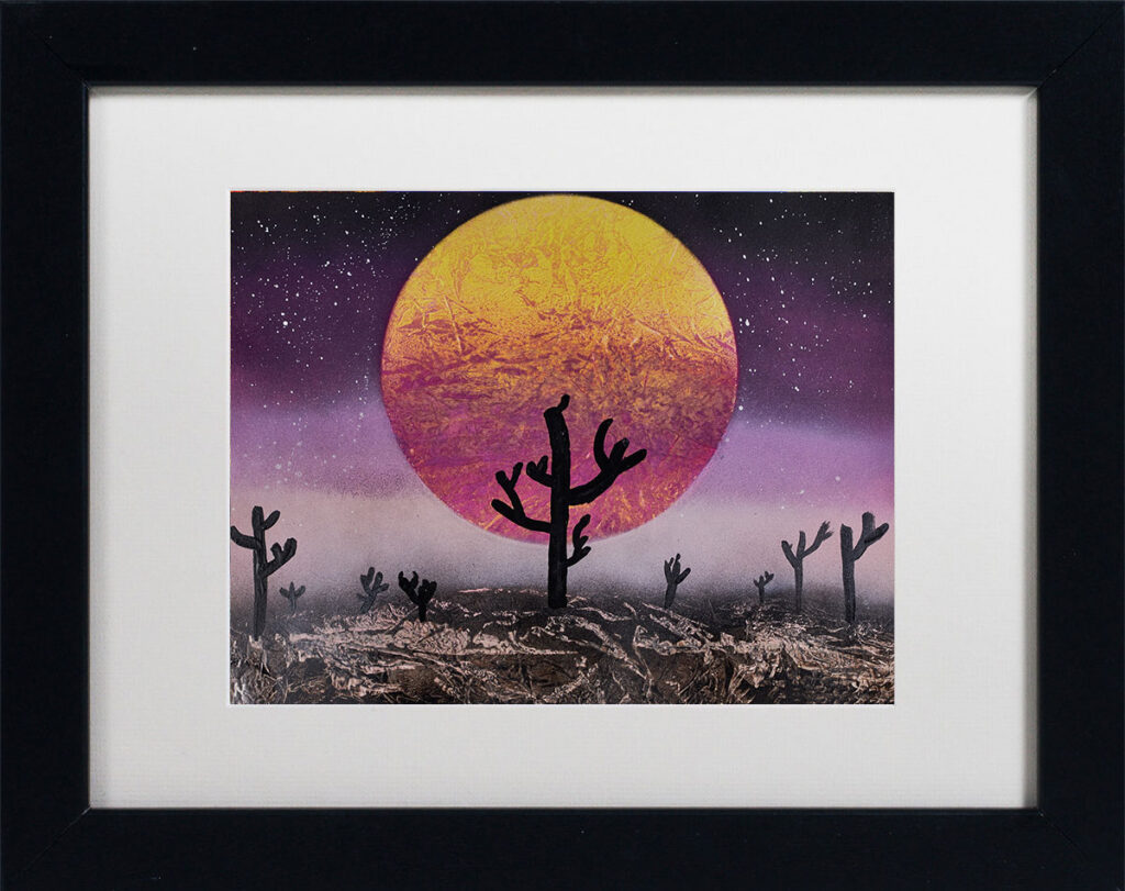 Arizona Mist - A sunset colored moon behind a desert landscape.